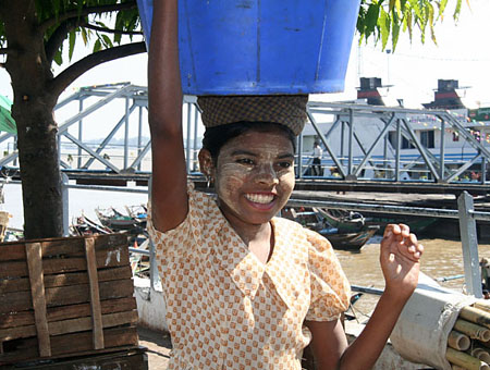 54 Smiling girl with lots of sunburn protection