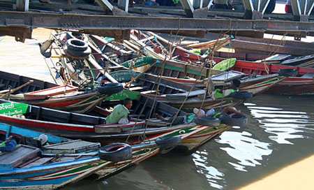 55 Lineup of little boats under the walkway