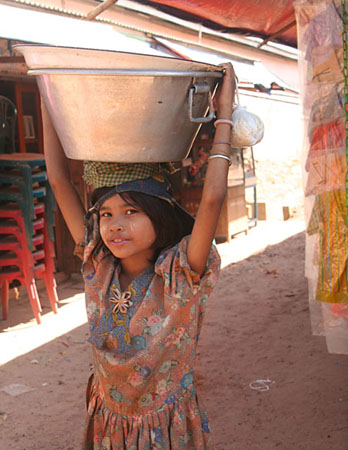 41 Girl  at market posing with tub