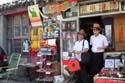 17 Two chaps in hats  in hutong store